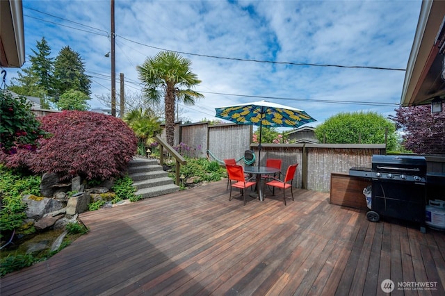 4245 Williams Ave W, Seattle, WA 98199 - wooden deck featuring outdoor dining area and a grill