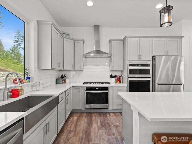 14505 117th St NE, Lake Stevens, WA 98258 - kitchen featuring stainless steel appliances, wall chimney range hood, gray cabinets, a sink, and recessed lighting