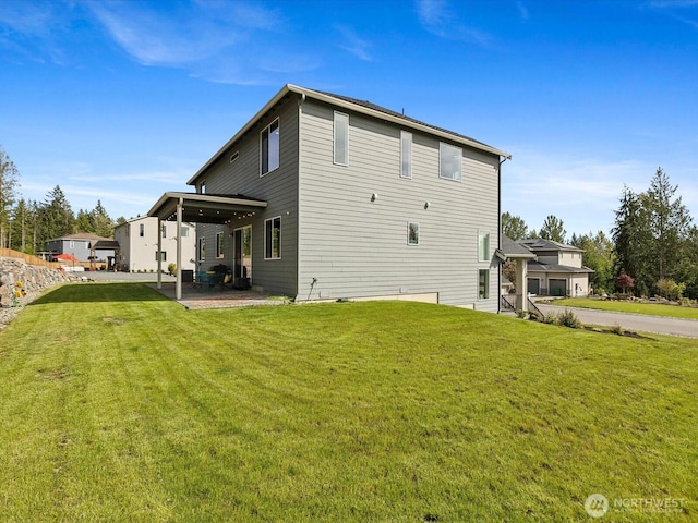 14505 117th St NE, Lake Stevens, WA 98258 - back of house with a lawn and a patio area
