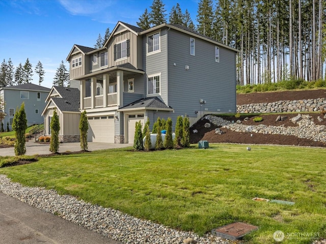 14505 117th St NE, Lake Stevens, WA 98258 - view of front of house with board and batten siding, an attached garage, driveway, and a front lawn