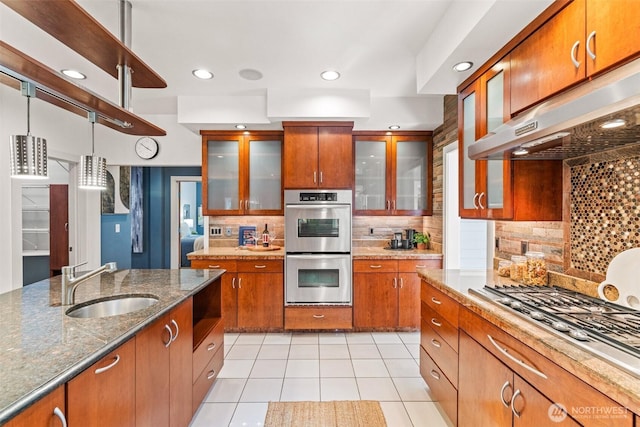 33025 129th Way SE, Auburn, WA 98092 - kitchen with under cabinet range hood, a sink, stainless steel appliances, brown cabinetry, and recessed lighting