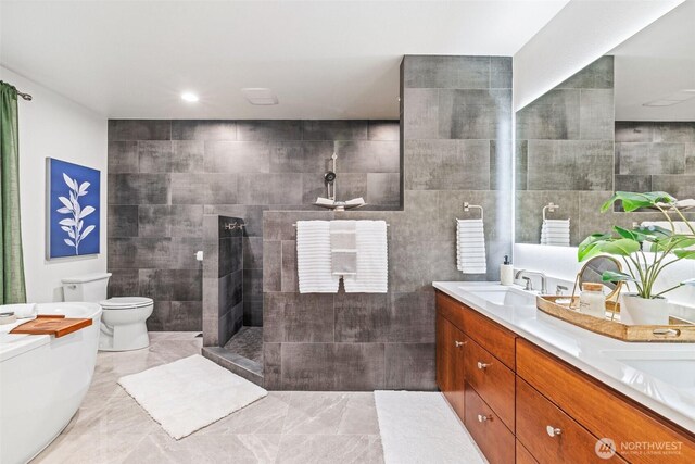 33025 129th Way SE, Auburn, WA 98092 - bathroom featuring toilet, tile walls, walk in shower, and double vanity