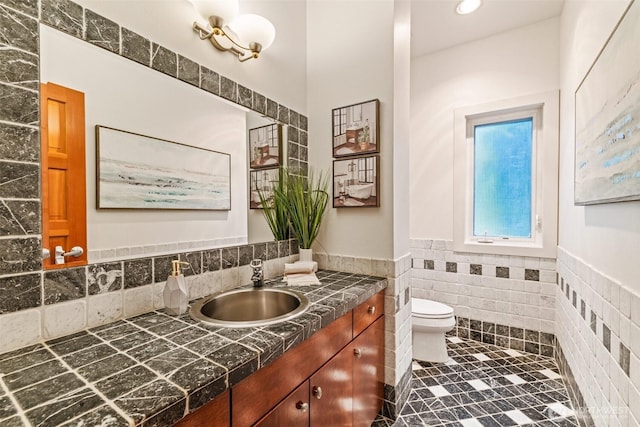 33025 129th Way SE, Auburn, WA 98092 - bathroom featuring tile walls, a wainscoted wall, toilet, vanity, and tile patterned flooring