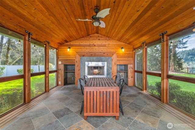 33025 129th Way SE, Auburn, WA 98092 - sunroom featuring wood walls, lofted ceiling, stone tile floors, and wood ceiling