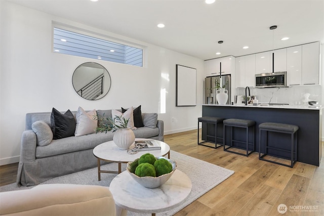8757B Palatine Ave N, Seattle, WA 98103 - living room with recessed lighting, light wood-style floors, and baseboards