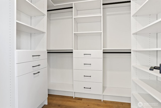 8757B Palatine Ave N, Seattle, WA 98103 - walk in closet featuring wood finished floors