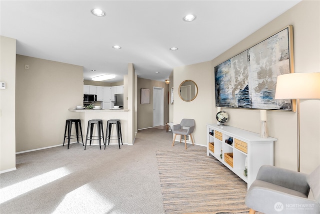 2040 13th Ave W Unit 13, Seattle, WA 98119 - living room with recessed lighting, light carpet, and baseboards