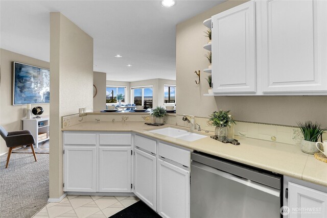 2040 13th Ave W Unit 13, Seattle, WA 98119 - kitchen featuring dishwasher, a sink, light countertops, white cabinets, and recessed lighting