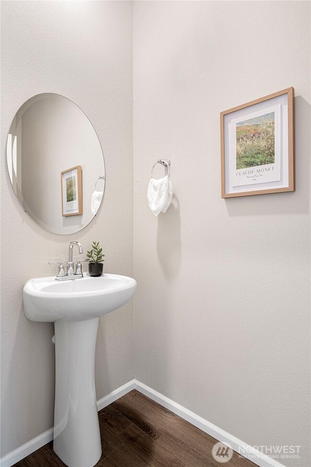 14126 SE 240th Pl, Kent, WA 98042 - bathroom featuring wood finished floors, baseboards, and a sink