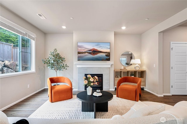 14126 SE 240th Pl, Kent, WA 98042 - living area with wood finished floors, a tiled fireplace, recessed lighting, and baseboards