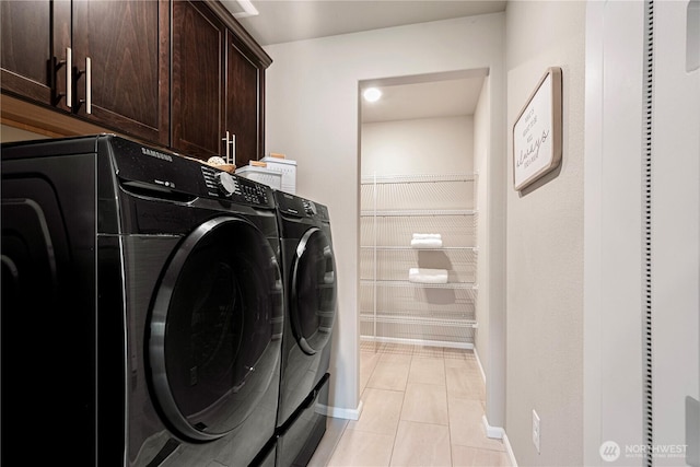 14126 SE 240th Pl, Kent, WA 98042 - laundry area with cabinet space, washer and clothes dryer, light tile patterned floors, and baseboards