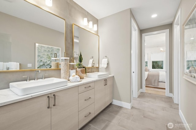 18809 99th Pl NE Unit A, Bothell, WA 98011 - bathroom with ensuite bathroom, double vanity, tile patterned flooring, and baseboards