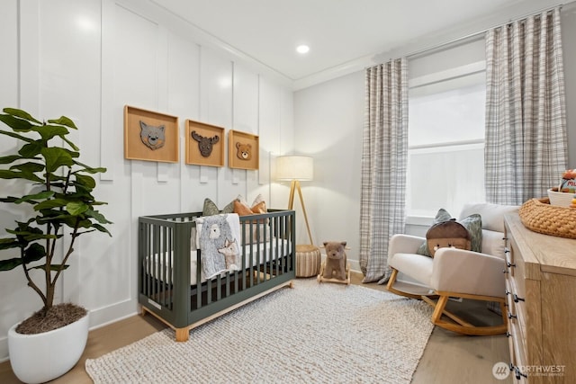 18809 99th Pl NE Unit A, Bothell, WA 98011 - bedroom with baseboards, wood finished floors, a crib, and recessed lighting