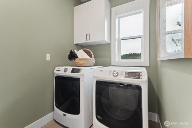18809 99th Pl NE Unit A, Bothell, WA 98011 - washroom featuring cabinet space, washer and dryer, and baseboards
