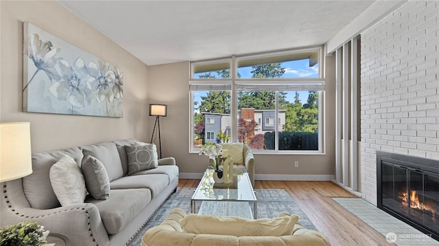3953 153rd Ave SE, Bellevue, WA 98006 - living room with a fireplace, wood finished floors, and baseboards