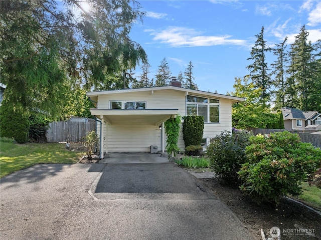3953 153rd Ave SE, Bellevue, WA 98006 - view of front of home with asphalt driveway, a carport, and a chimney