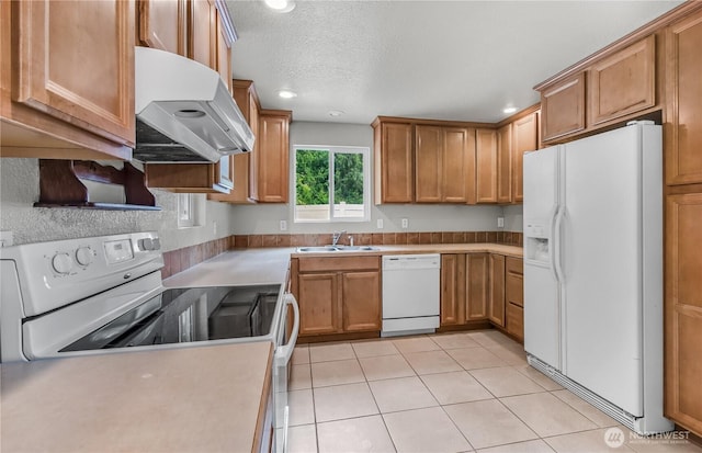 15828 3rd Ave SE, Bothell, WA 98012 - kitchen with white appliances, ventilation hood, a sink, brown cabinets, and recessed lighting