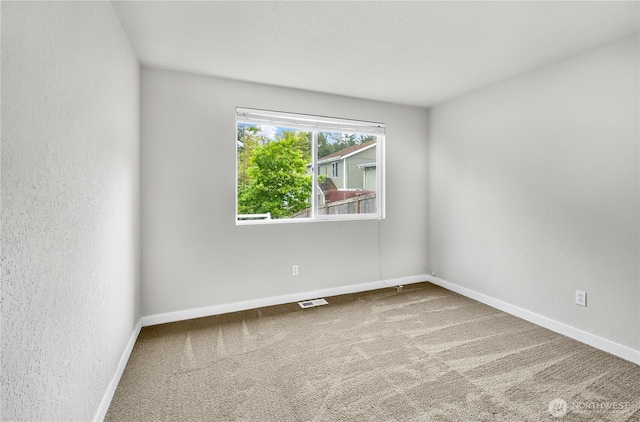 15828 3rd Ave SE, Bothell, WA 98012 - carpeted spare room featuring baseboards