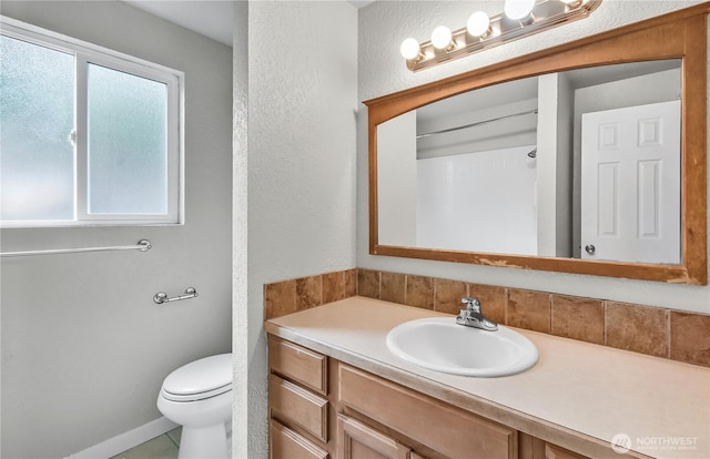 15828 3rd Ave SE, Bothell, WA 98012 - bathroom featuring vanity, toilet, and a textured wall