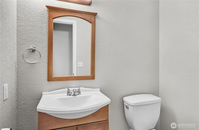 15828 3rd Ave SE, Bothell, WA 98012 - bathroom featuring vanity, toilet, and a textured wall