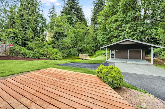 15828 3rd Ave SE, Bothell, WA 98012 - wooden deck featuring driveway, a lawn, a garage, and a carport