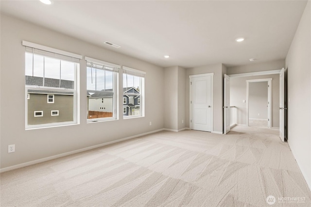769 SE 12th Pl Unit 29, North Bend, WA 98045 - spare room with light colored carpet, baseboards, and recessed lighting