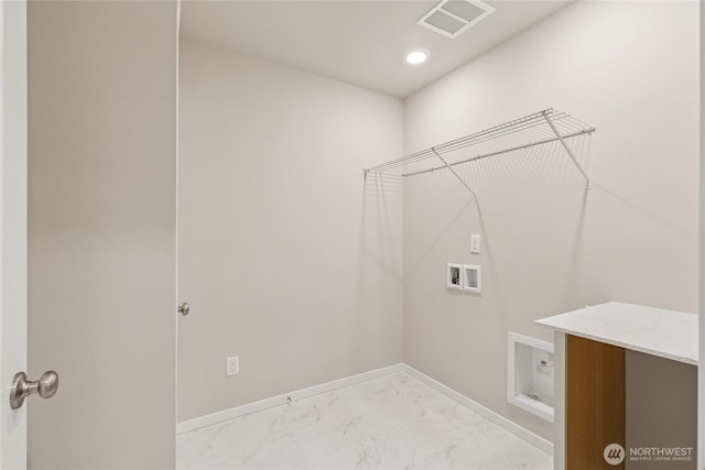 769 SE 12th Pl Unit 29, North Bend, WA 98045 - laundry area with hookup for a washing machine, light marble finish floors, and baseboards