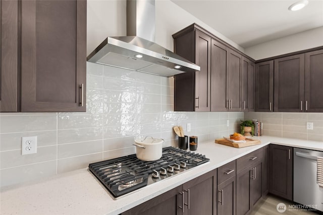 769 SE 12th Pl Unit 29, North Bend, WA 98045 - kitchen with wall chimney exhaust hood, stainless steel appliances, dark brown cabinetry, and tasteful backsplash