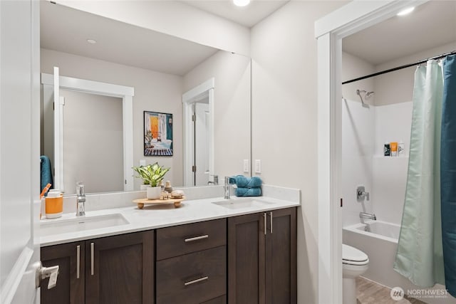 769 SE 12th Pl Unit 29, North Bend, WA 98045 - bathroom featuring double vanity, toilet, and shower / bath combo