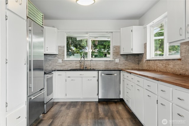 415 Snow Mass Ln, Yakima, WA 98908 - kitchen with a sink, appliances with stainless steel finishes, dark wood finished floors, and butcher block counters