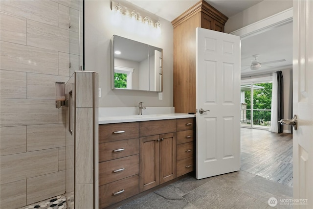 415 Snow Mass Ln, Yakima, WA 98908 - bathroom featuring vanity, a tile shower, and ceiling fan