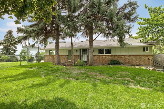 415 Snow Mass Ln, Yakima, WA 98908 - view of front facade with brick siding, board and batten siding, and roof with shingles