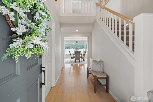 11521 E State Route 106, Union, WA 98592 - entryway featuring stairs, light wood-type flooring, baseboards, and a towering ceiling