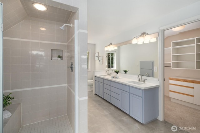 11521 E State Route 106, Union, WA 98592 - bathroom with double vanity, a tile shower, toilet, and tile patterned flooring