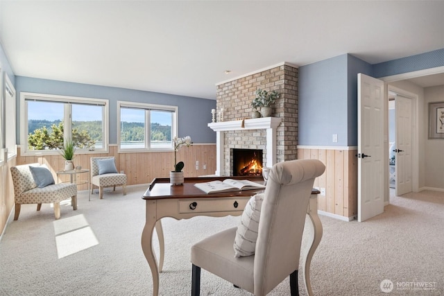11521 E State Route 106, Union, WA 98592 - living room with light colored carpet, wood walls, wainscoting, and a fireplace