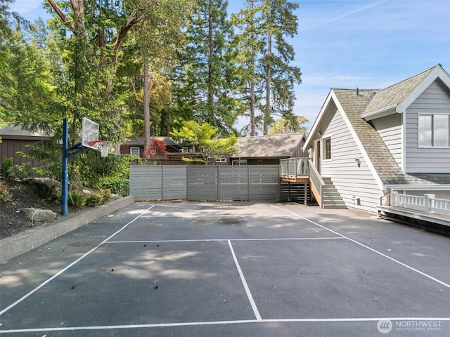 11521 E State Route 106, Union, WA 98592 - view of property exterior with uncovered parking, roof with shingles, and stairway