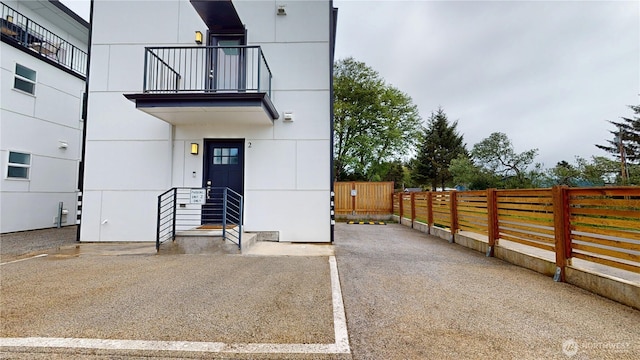 890 Magellan Ave NE Unit 2, Ocean Shores, WA 98569 - doorway to property with a balcony and uncovered parking