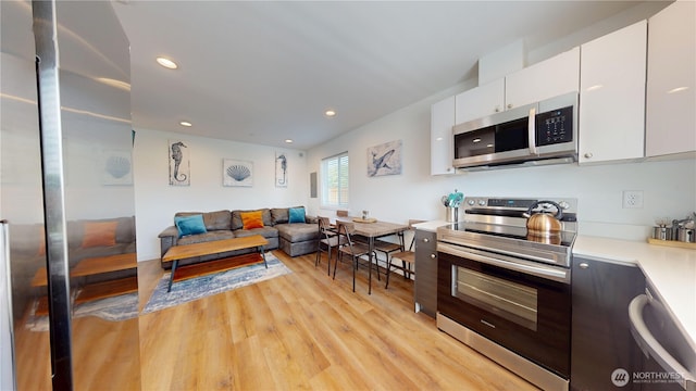 890 Magellan Ave NE Unit 2, Ocean Shores, WA 98569 - living area with light wood finished floors and recessed lighting