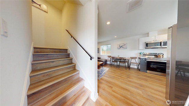 890 Magellan Ave NE Unit 2, Ocean Shores, WA 98569 - stairs featuring wood finished floors and recessed lighting