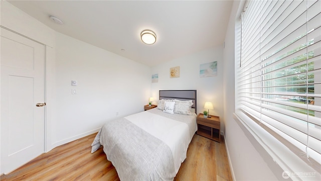 890 Magellan Ave NE Unit 2, Ocean Shores, WA 98569 - bedroom featuring light wood-style floors and baseboards