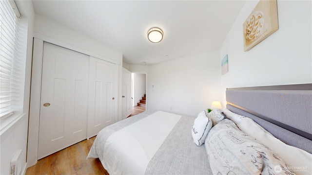 890 Magellan Ave NE Unit 2, Ocean Shores, WA 98569 - bedroom with light wood-style floors and a closet
