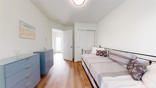 890 Magellan Ave NE Unit 2, Ocean Shores, WA 98569 - bedroom featuring light wood-style flooring and a closet