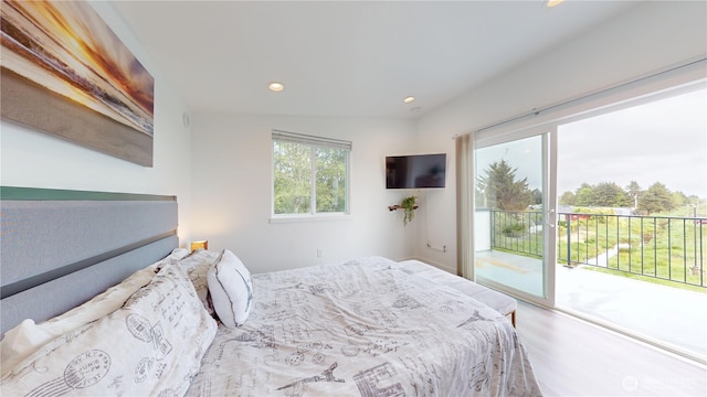 890 Magellan Ave NE Unit 2, Ocean Shores, WA 98569 - bedroom with access to exterior, recessed lighting, and wood finished floors