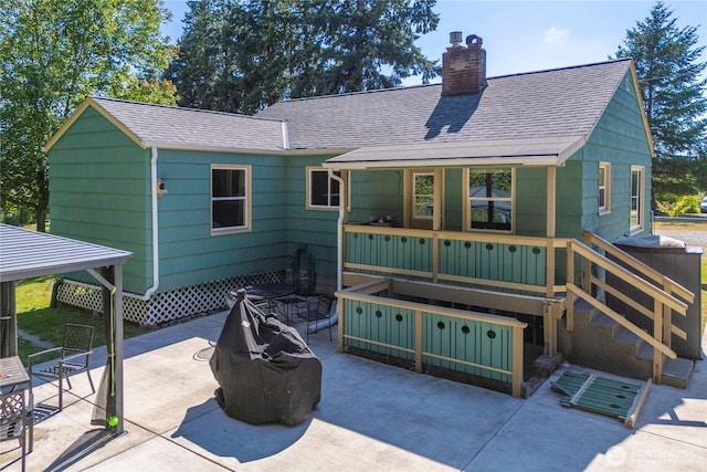 4211 108th Ave E, Edgewood, WA 98372 - back of property with roof with shingles, a chimney, and a patio