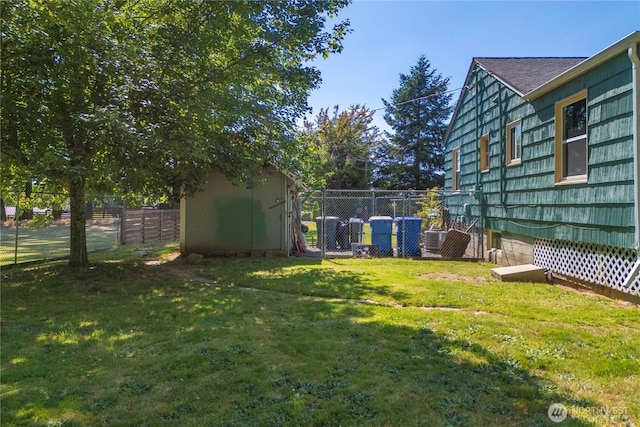 4211 108th Ave E, Edgewood, WA 98372 - fenced backyard featuring a storage unit