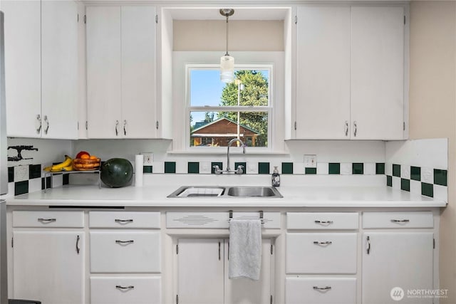 4211 108th Ave E, Edgewood, WA 98372 - kitchen featuring white cabinets, light countertops, and pendant lighting