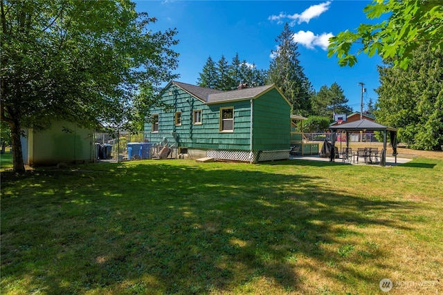 4211 108th Ave E, Edgewood, WA 98372 - back of property with a gazebo, a lawn, and a chimney
