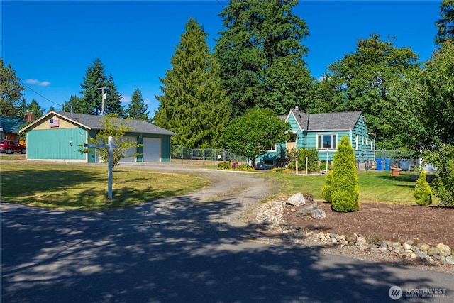 4211 108th Ave E, Edgewood, WA 98372 - view of front facade featuring driveway, a garage, and a chimney