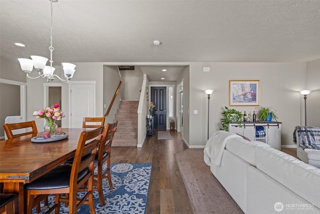 301 K St NE, Quincy, WA 98848 - dining room featuring a chandelier, wood finished floors, stairway, baseboards, and recessed lighting