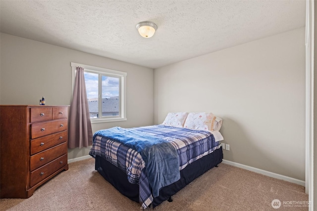 301 K St NE, Quincy, WA 98848 - bedroom featuring light colored carpet, baseboards, and a textured ceiling